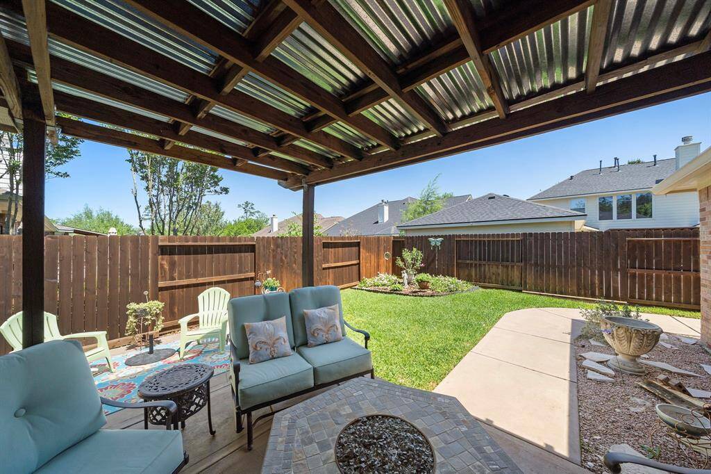 Step outside to your own backyard retreat featuring a spacious deck and multiple seating areas, ready for morning coffee, weekend grilling, or evenings under the stars.