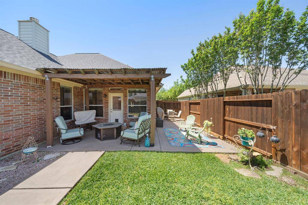 This charming backyard offers charm and relaxation.