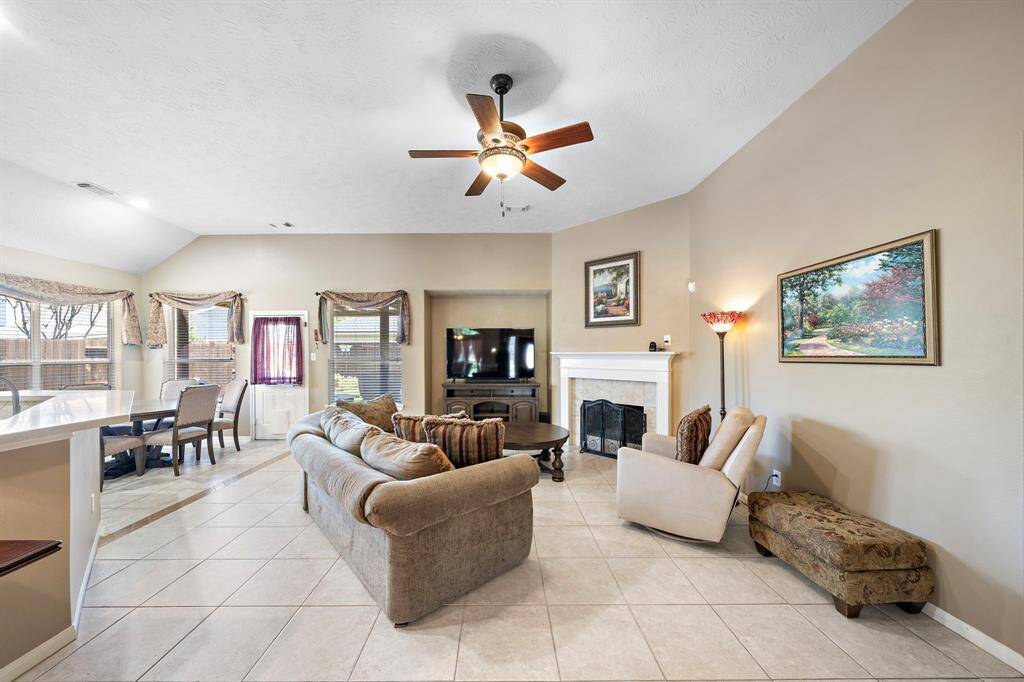 The open-concept layout offers a seamless flow between the spacious living, dining, and kitchen areas—perfect for everyday living and effortless entertaining.