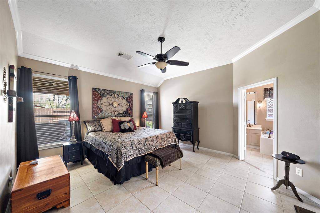 The primary suite is privately tucked and includes a bonus study just off the bedroom—ideal for a home office, workout space, or cozy reading nook.