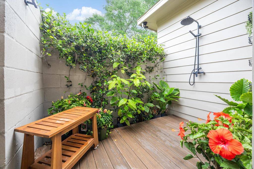 Outdoor shower attached to primary shower area