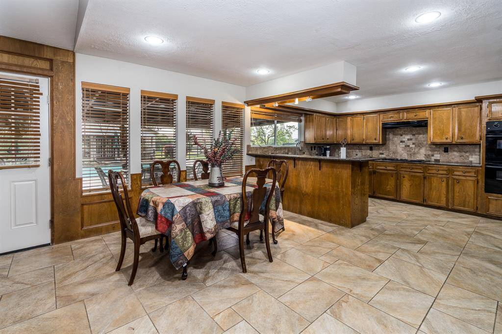 Pool views from the kitchen and dining spaces.