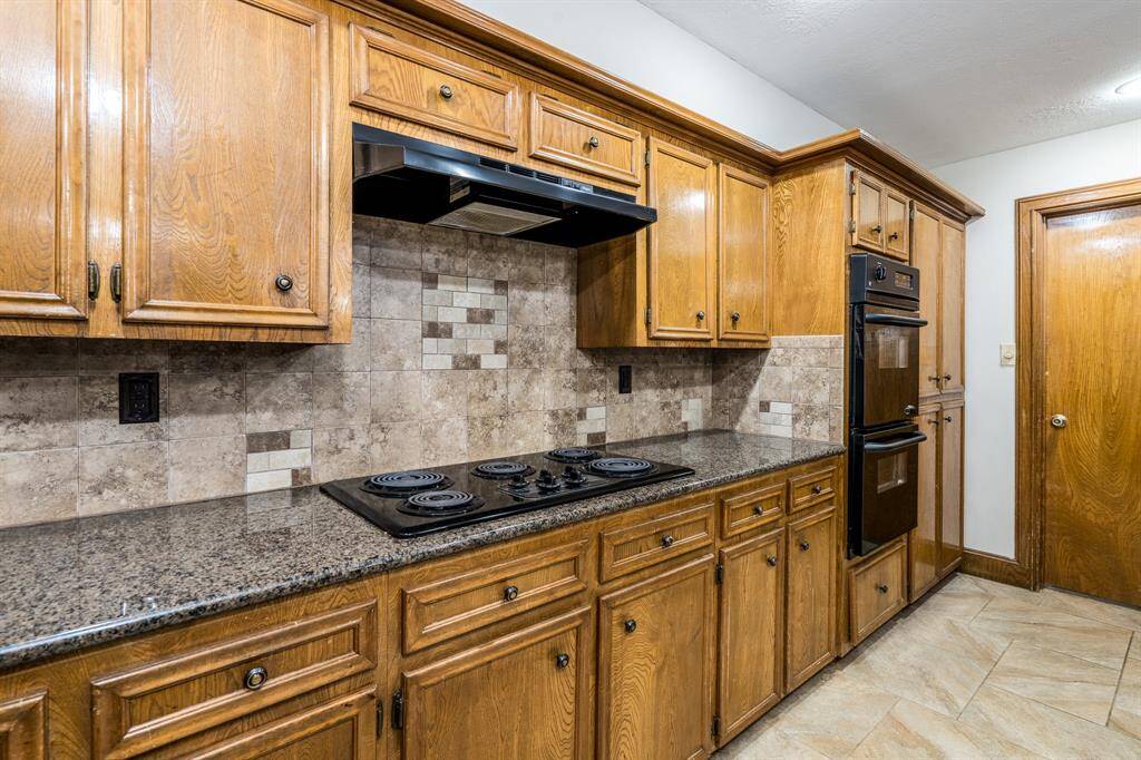 Tons of storage area including a nearby laundry with room for an additional fridge.