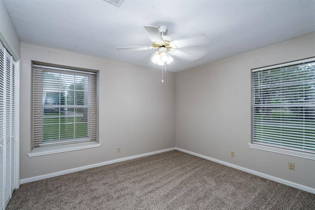 Corner bedroom has two windows.