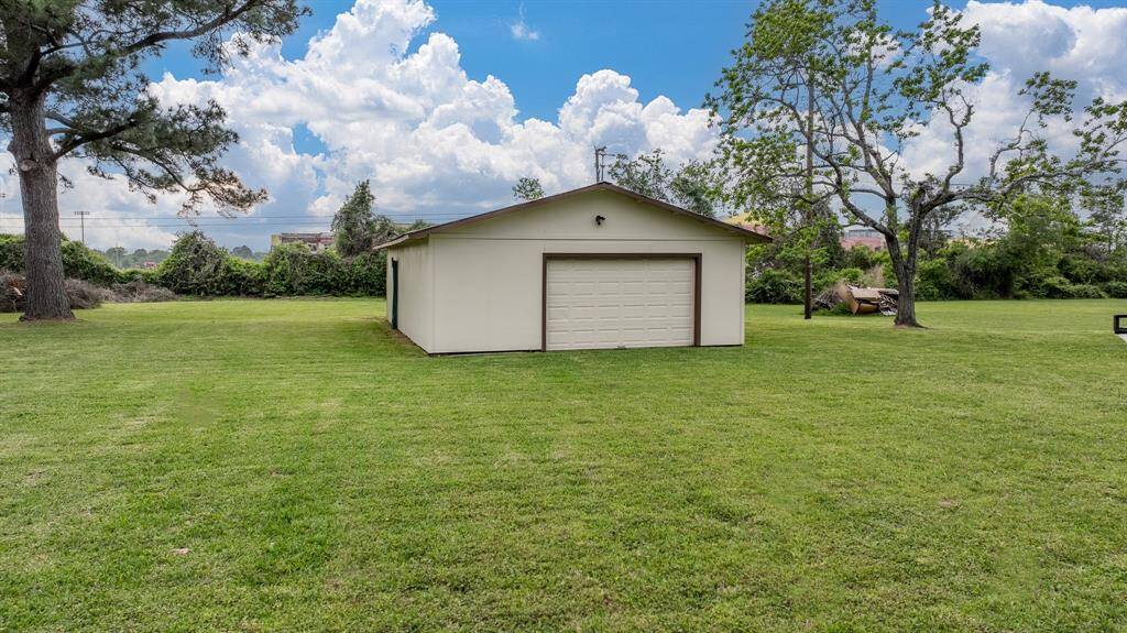 Large storage building could be your garage in addition to the covered parking area.