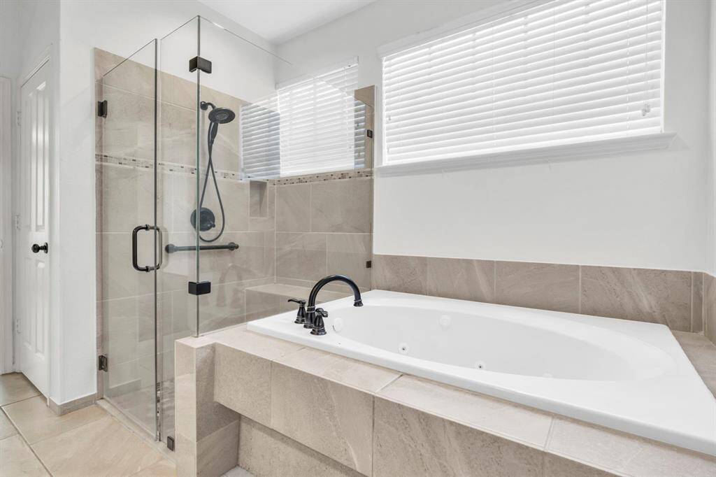 Downstairs tub and shower in primary