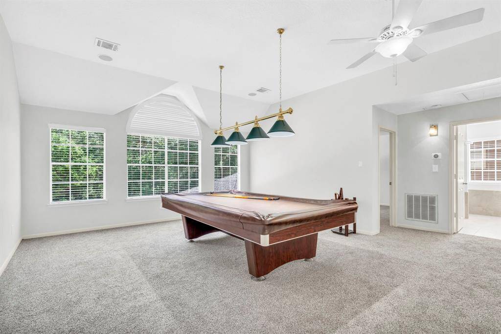 Upstairs game room overlooking the pool.  If you like, the 9 foot pool table remains.