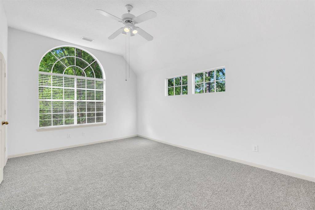 Large upstairs bedroom with its own en suite.  Lovely arched  window overlooking the front and the park