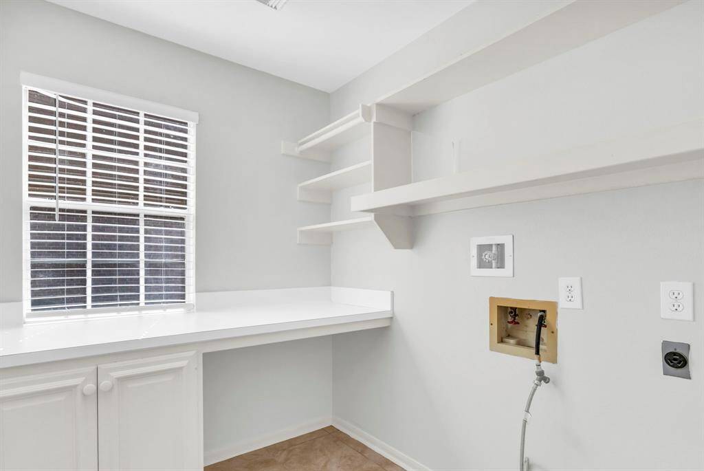 Laundry room with storage