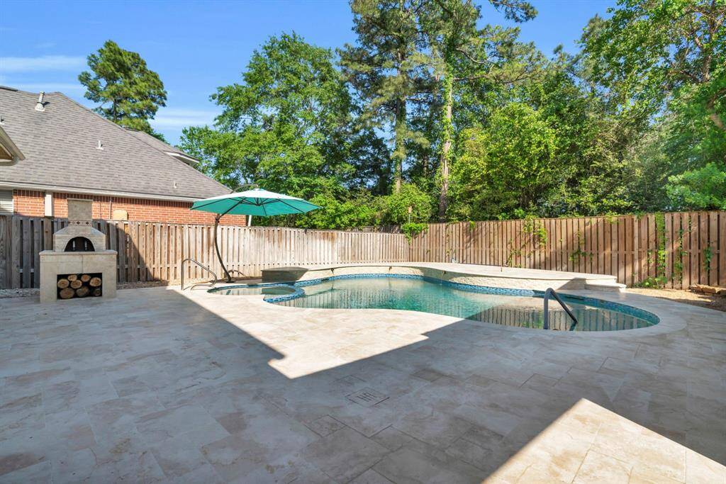Backyard pool, renovated and resurfaced summer 2024.  Includes hot tub and pizza oven.