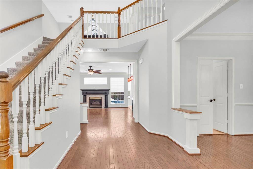Standing in the front, looking into home, formal dining to the right, family room to the back.