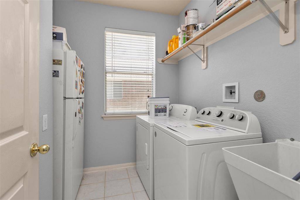 Bright and inviting addition in the primary bedroom featuring expansive windows that offer beautiful natural light and serene views of the lush backyard. Perfect for relaxing and reading nook.