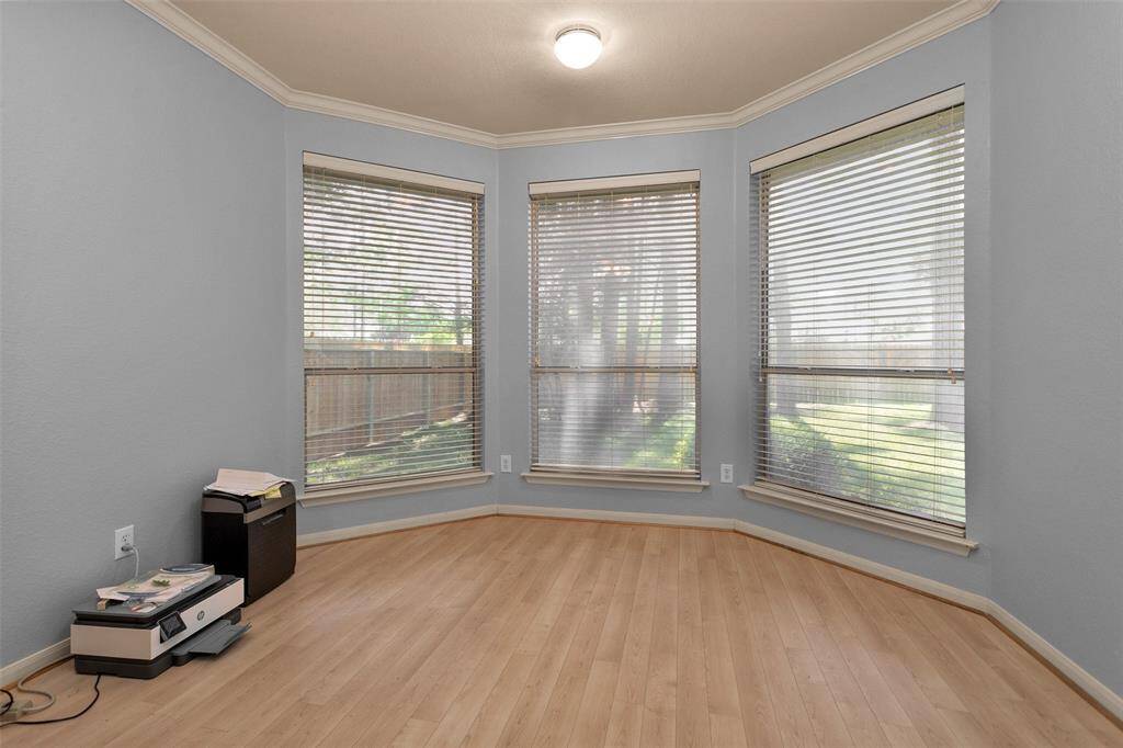 Spacious and elegant primary bathroom featuring dual vanities, a luxurious soaking tub, and a sleek glass-enclosed shower. Perfect for relaxation and style.