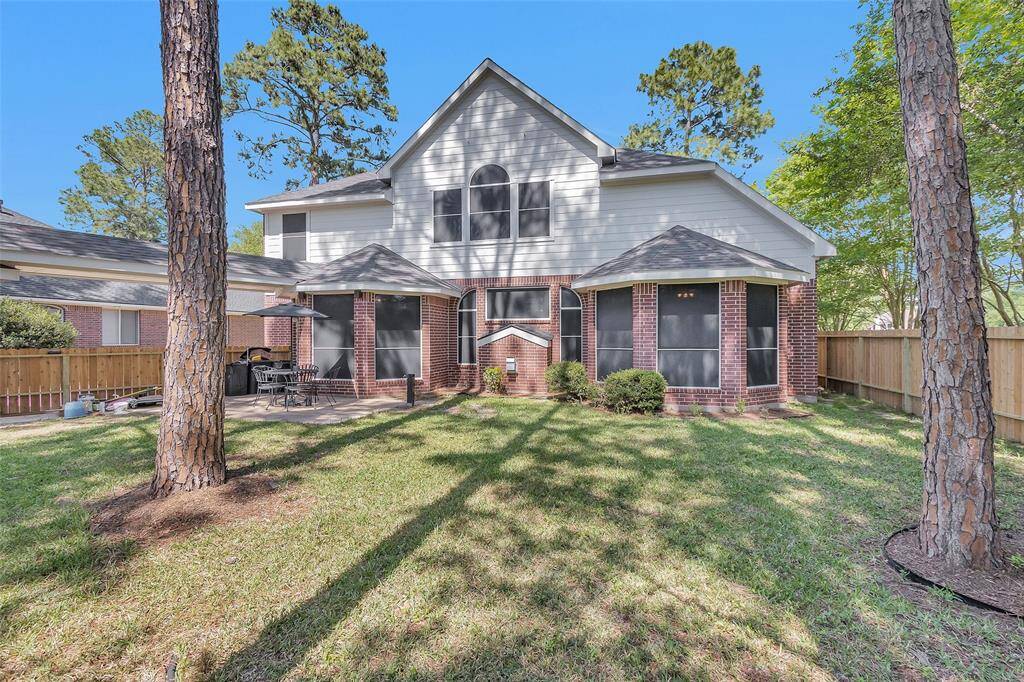 Discover your serene retreat with this spacious backyard, beautifully shaded by mature trees and enclosed by a new privacy fence. Perfect for relaxation and outdoor activities.