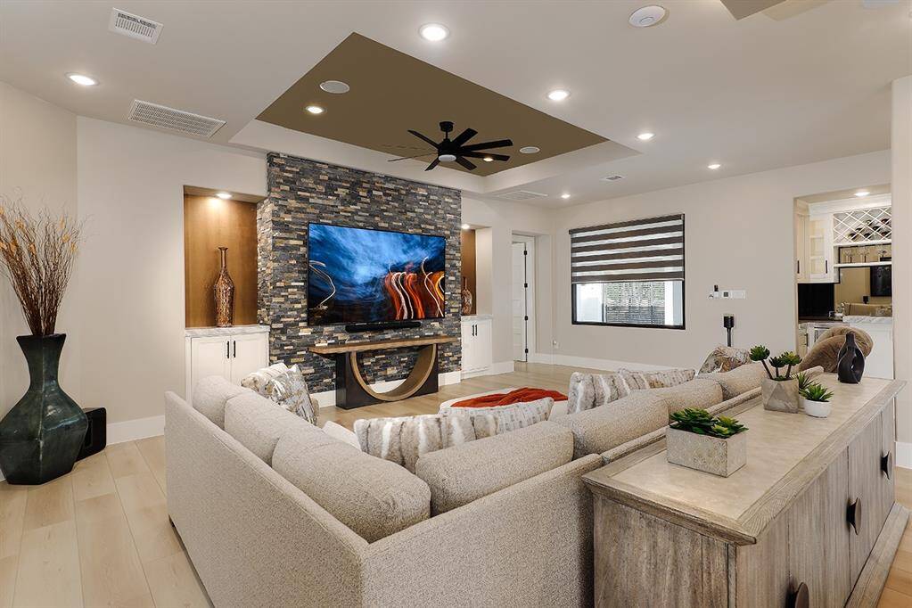 The intricately carved ceilings, Sonos sound system and gorgeous high end composite flooring are noted throughout.