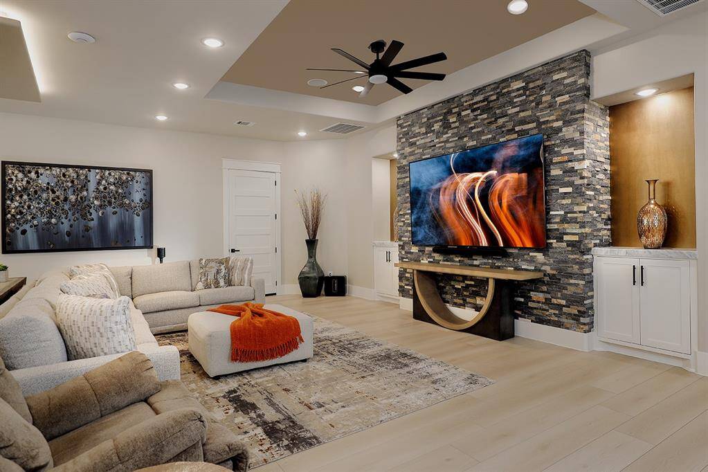 This 100" television and luxurious, yet comfortable seating with easy access to the kitchen will make watching movies with the family enticing!