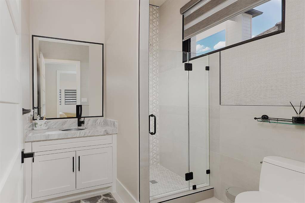 Each of the bathrooms in the home feature quartz counters, custom soft close cabinetry and exquisite tile designs.