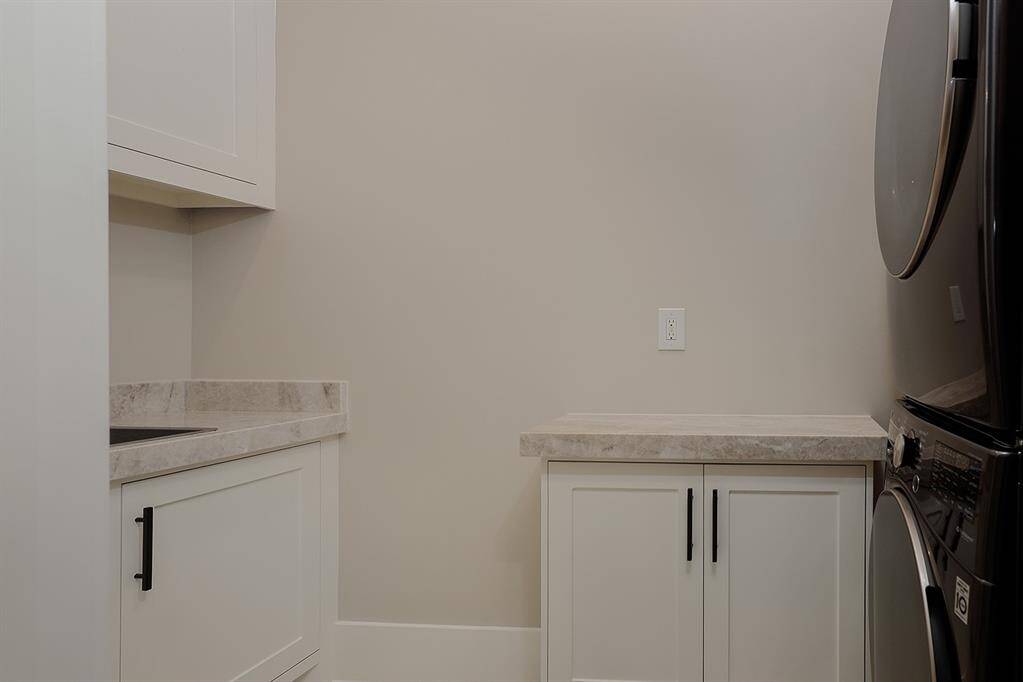 The west wing offers its own laundry room with sink, so your guests have that added convenience.