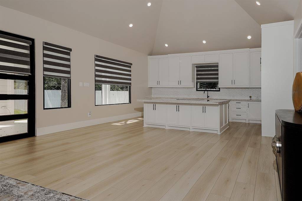 The living area and kitchen of the west wing provide additional space for guests to relax and unwind.