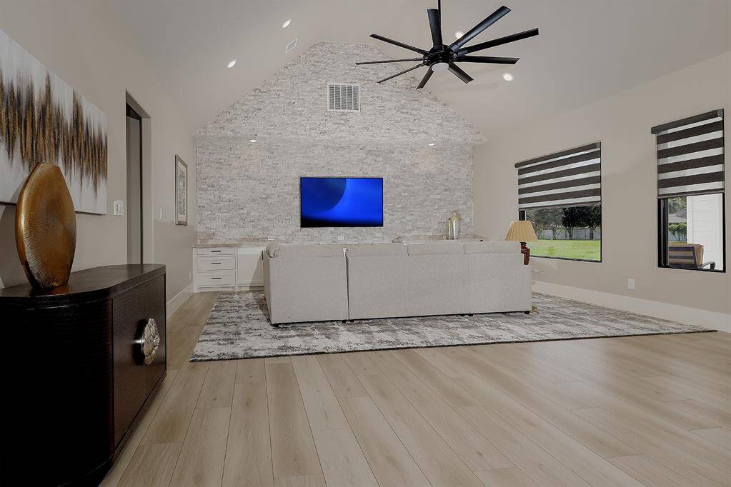 The vaulted ceiling and gorgeous accent wall in the west wing living area.