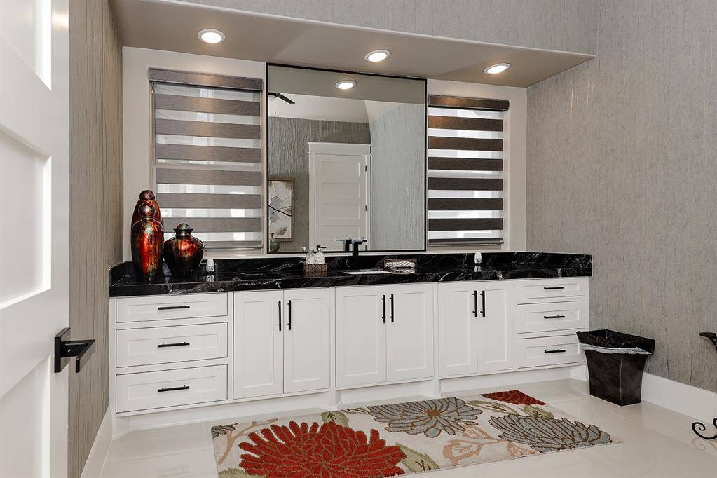 The wallpaper in these bathrooms is exquisite, as are the finishes.