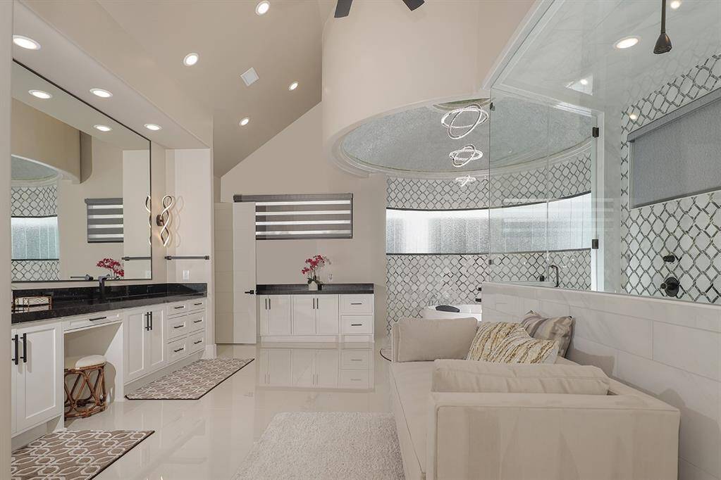 This is the bathroom of your dreams! With dual vanities, an enormous shower and large format porcelain tile flooring, the craftmanship is unparalleled.
