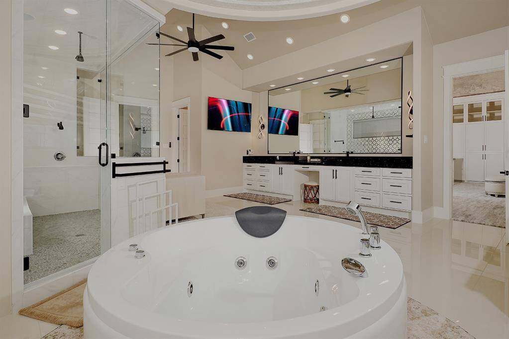 A view of the Japanese soaking tub and shower in the primary bath.