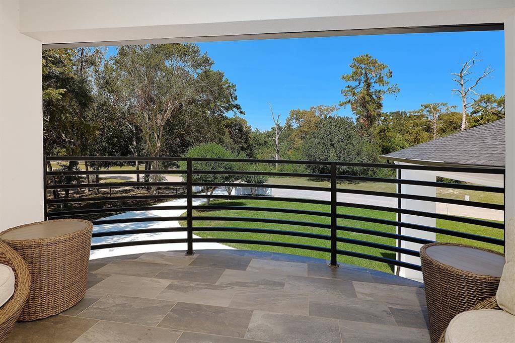 This balcony off the 2nd primary suite upstairs would be the perfect place for your morning coffee.