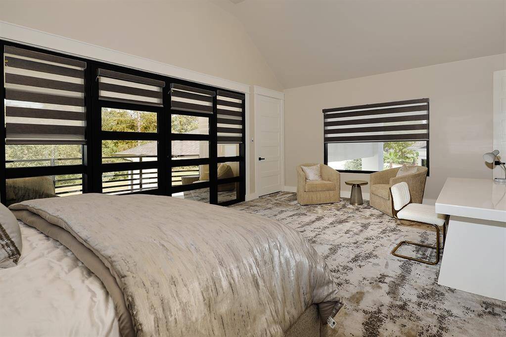 The 2nd owner's suite upstairs has a cozy sitting area and a desk to work from home.