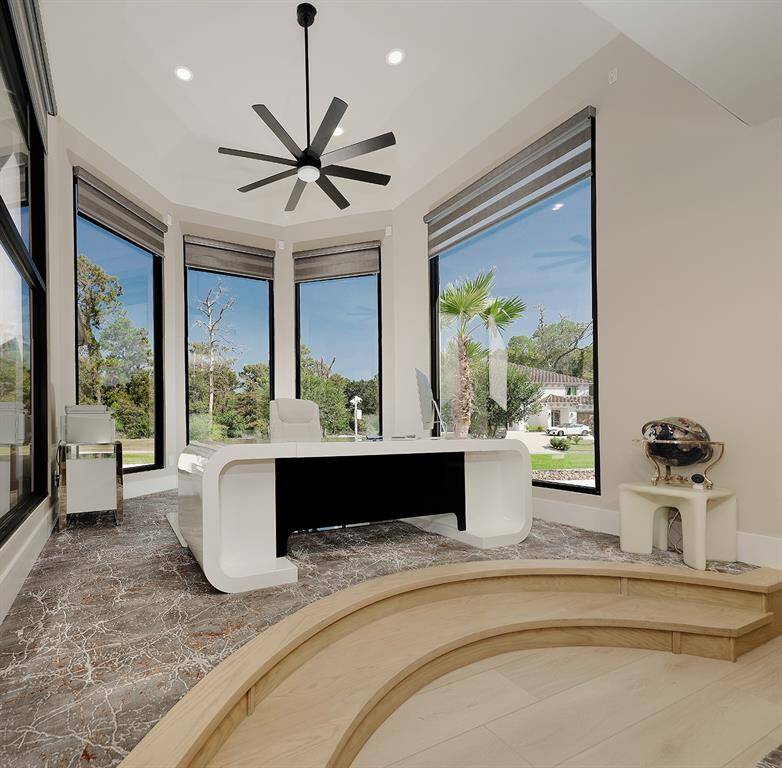 This flexible space can be utilized as an inviting home office or to showcase an exceptional piece of art work.