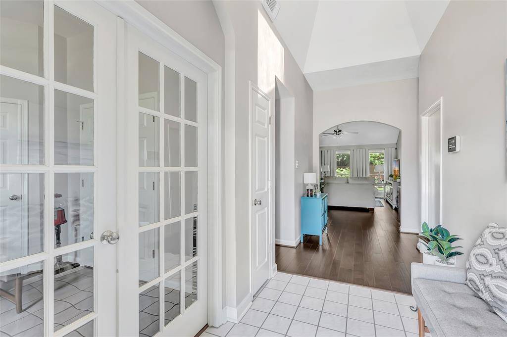 In the entry way, with the office on the left and the living room towards the back of the house.