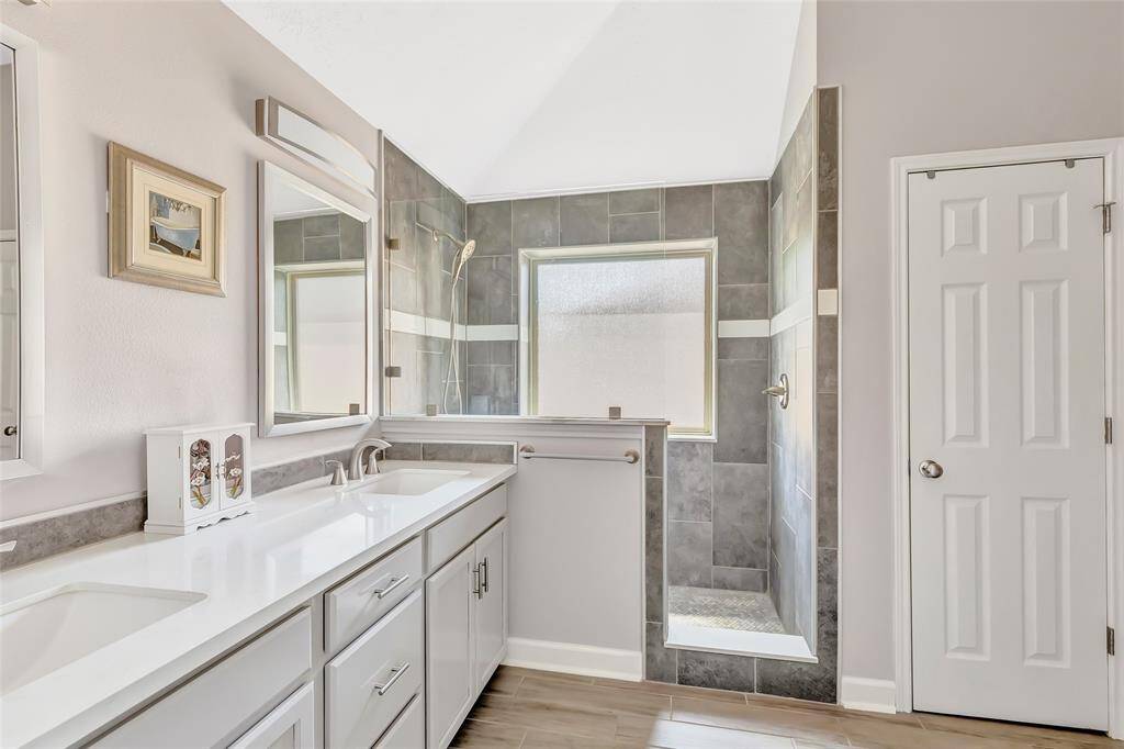 A great view of the walk-in shower in the primary bathroom.