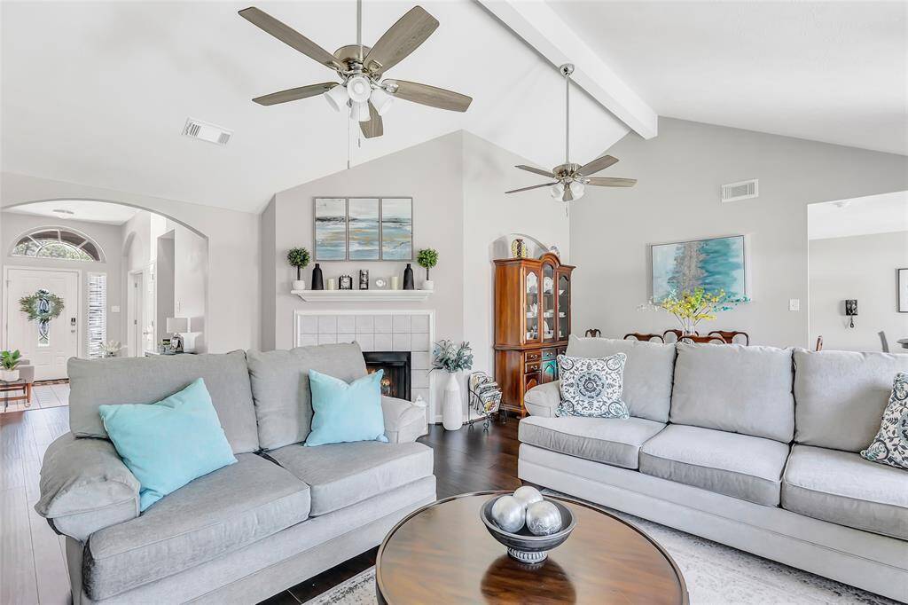 This view shows the living room, the entry, the dining room and part of the breakfast room.