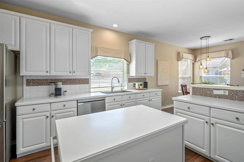 So much storage in this light & bright kitchen!
