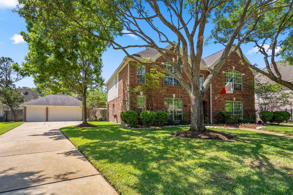 3 car detached garage and long driveway