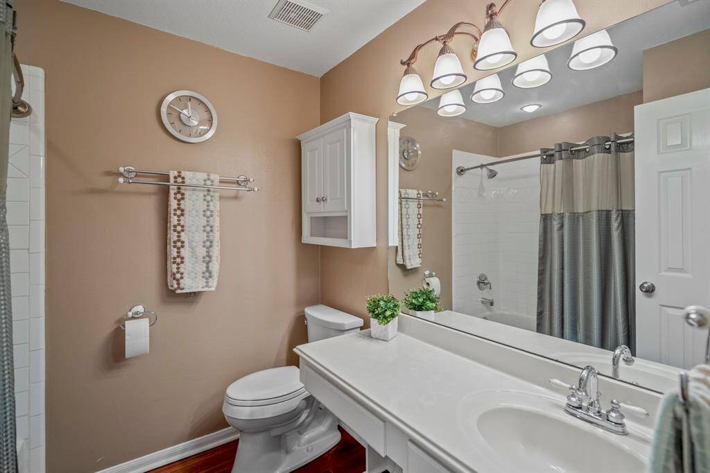 Secondary bath in hall adjacent to game room and between Bedrooms #4 and #5