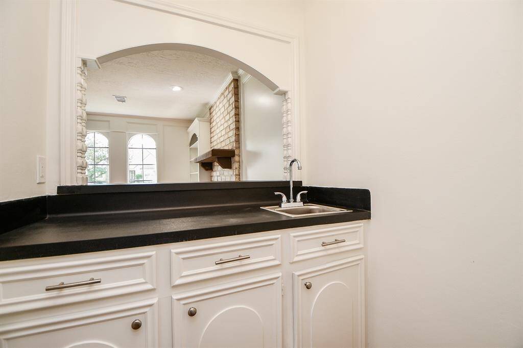 Wet bar with access from the kitchen and a view to the living.