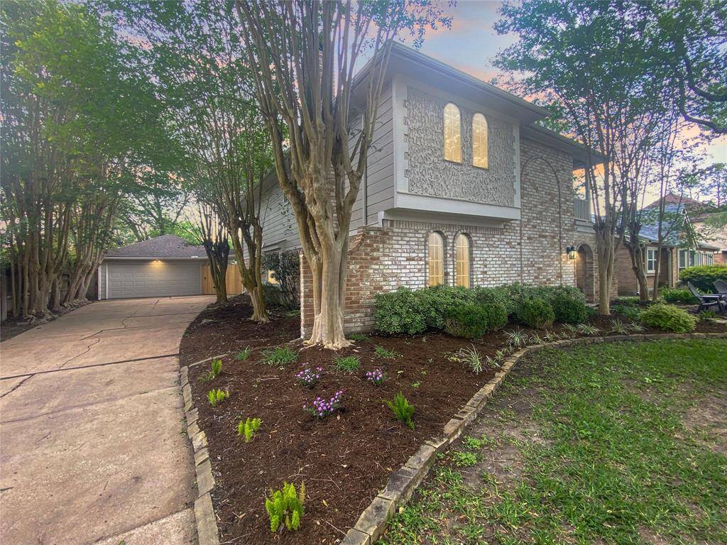 Gorgeous crepe myrtles line the driveway greeting you as you return home.