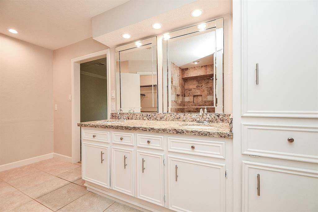 Lots of cabinet storage space and an extra nook to the left for any additional storage needs, secondary vanity, etc.