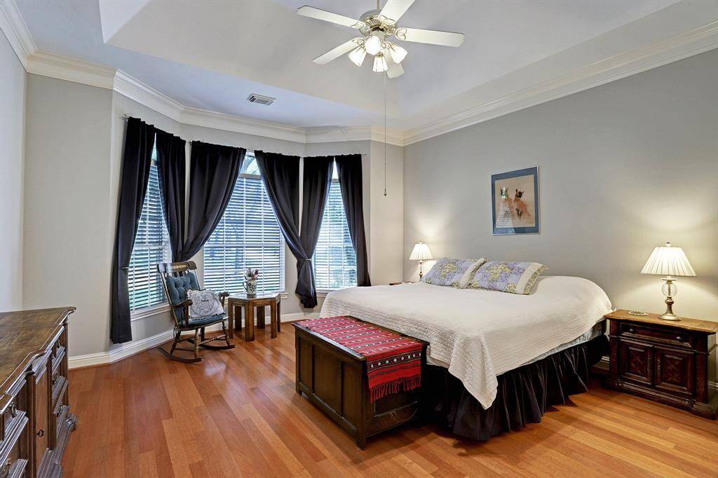 Updated master bathroom, double vanities and over-sized tile floor, sit-down make-up area, oversized shower and jetted tub. This is amazing! In addition, the shower includes a seating bench and shelves which include grab bars (handicap rated).
