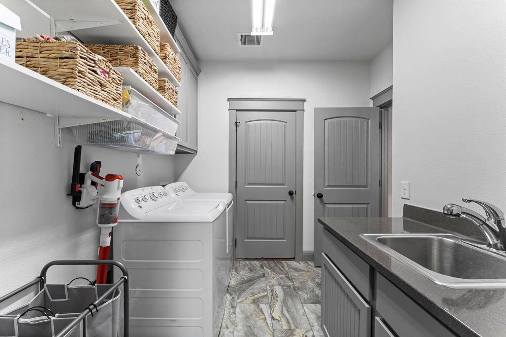 Another view of the laundry room and access to the garage.  Other door to the kitchen.
