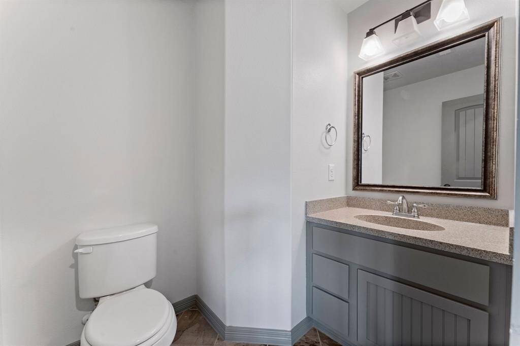 Half bath with easy access to the game room and media room.