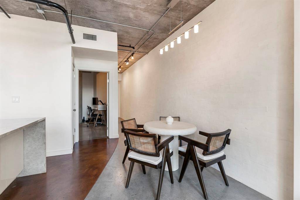 Dinning area is open to kitchen and living. Also space to add a few barstools. Door is open to 1st floor bedroom.