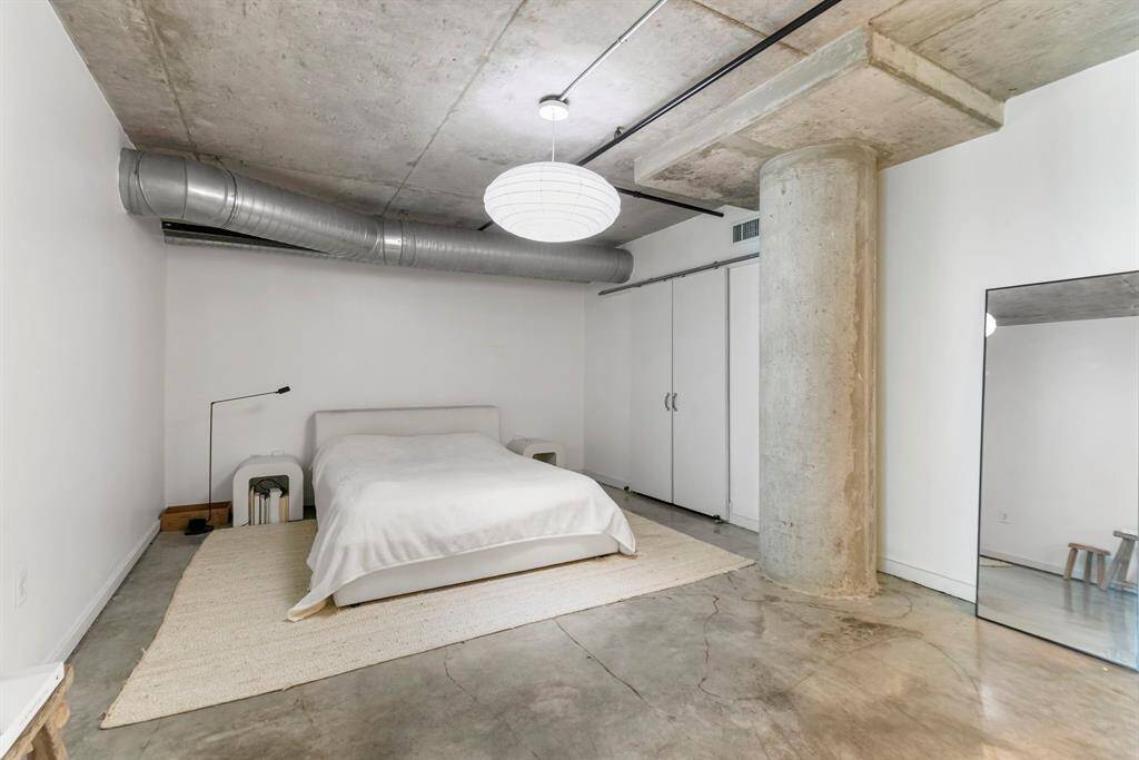 2nd floor Primary bedroom is it's own primary suite measuring 19X13. Easy to maintain concrete flooring throughout this entire loft. No carpet in this loft! Doors open to a large walk-in closet.