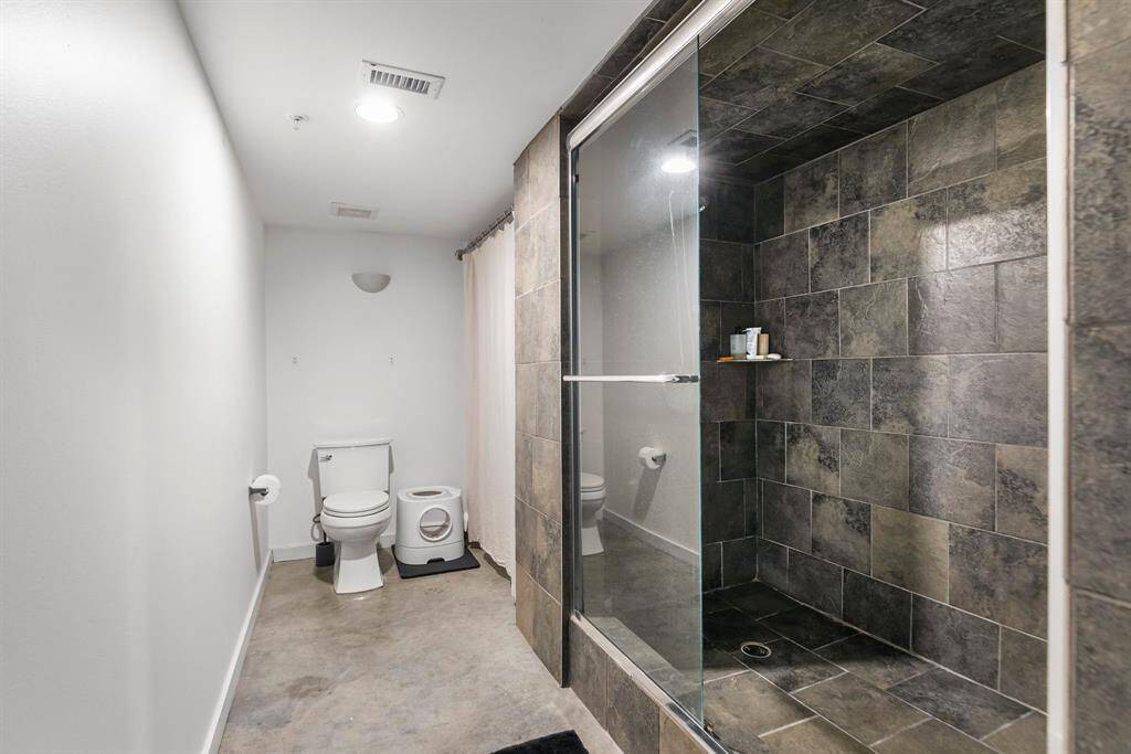 You have a huge walk-in shower AND a separate soaking tub. There is also a linen closet.