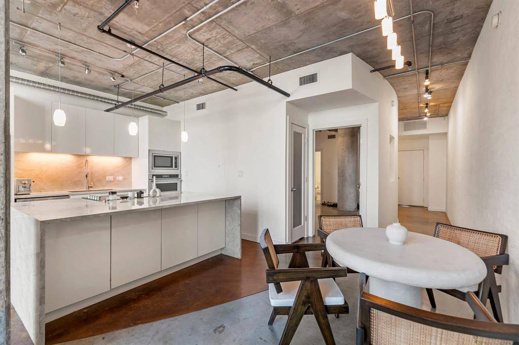 The 1st floor bedroom is located off of the kitchen.