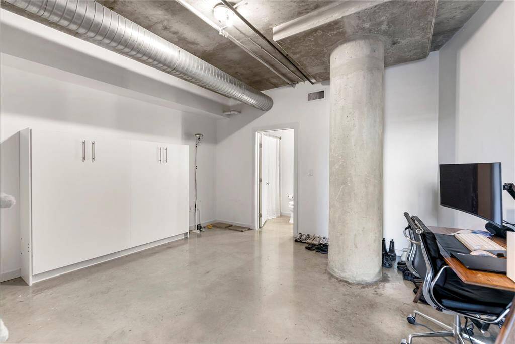 1st floor bedroom has a Murphy bed that is included. Open door leads to ensuite bath.