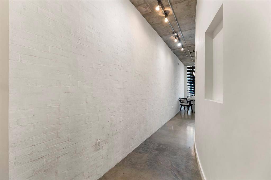 Immediately upon entering this loft, you will notice ALL of the incredible updates. This white brick entry wall is lime slurry which is a rare technique that only certain artists have perfected.