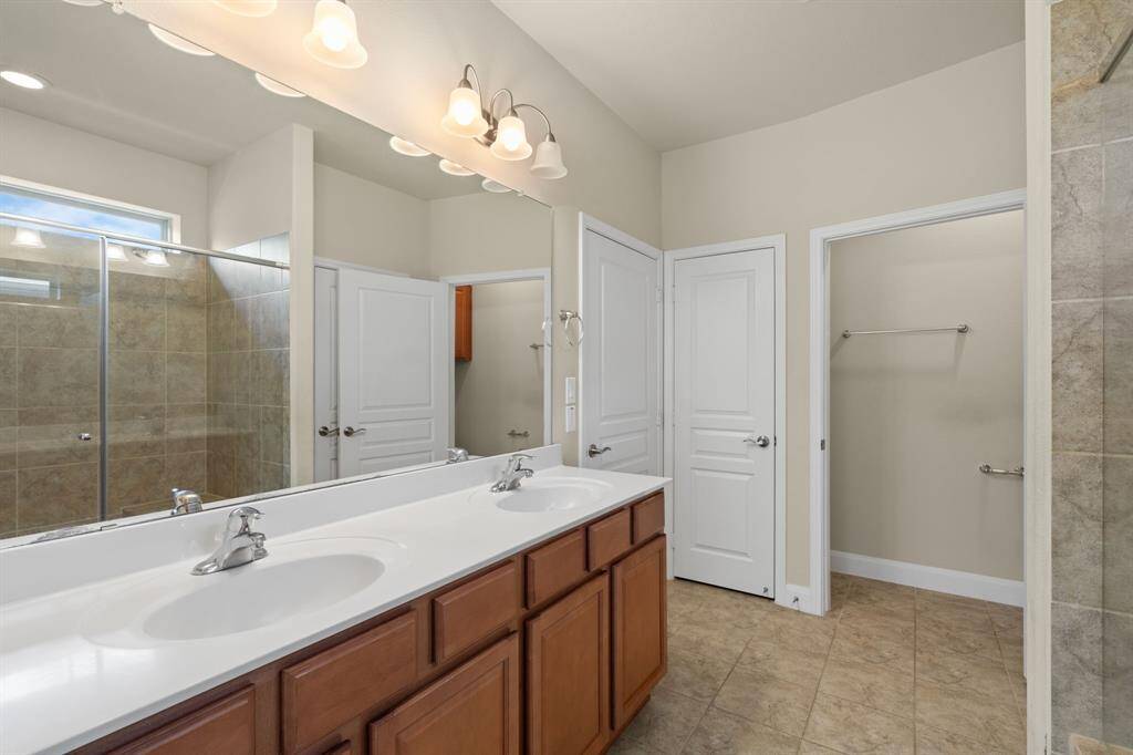 Conveniently placed medicine cabinet adds extra storage, keeping your essentials within easy reach while maintaining a clean, organized space.