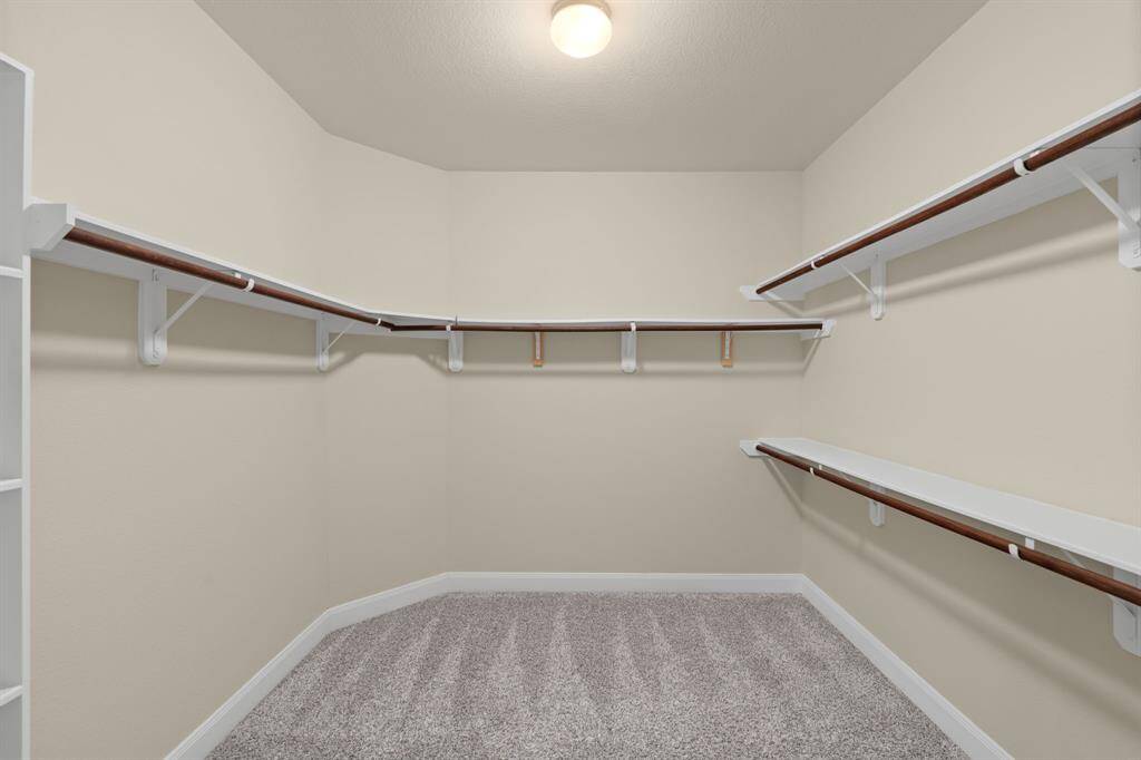 Bright and versatile, the secondary bedroom is perfect for guests, a home office, or a cozy retreat—endless possibilities await!